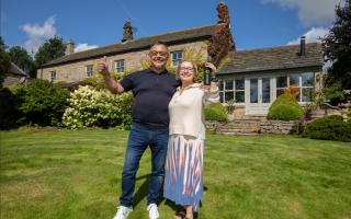 Eliza Yahioglu (right) and her husband Gokhan outside their new home