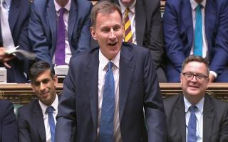 Rishi Sunak looks on as Jeremy H unt delivers his Autumn Statement (Image: PA)