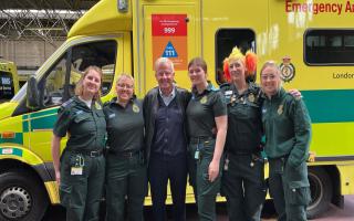 Michael Toppin with Camden Ambulance Station crews two years after a near fatal cardiac arrest in a supermarket
