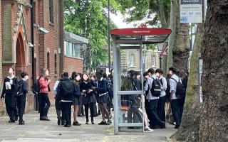 School children waiting for the 603 bus which has been described by campaigners as a 'ghost' route