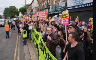 Anti-racist protestors line the street in North Finchley